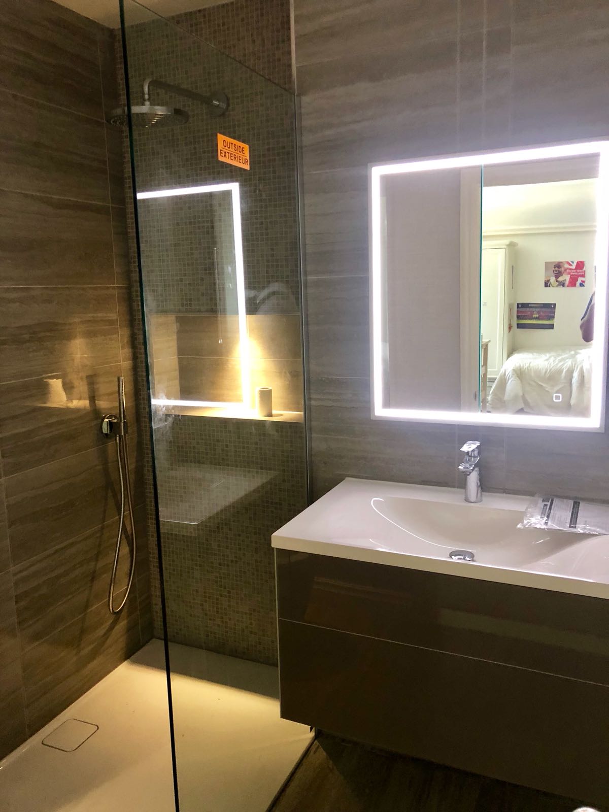 Modern bathroom with glass shower enclosure