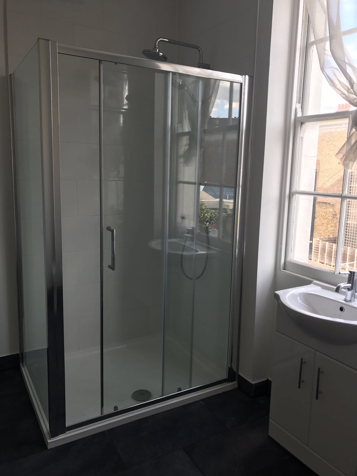 Walk-in shower glass enclosure