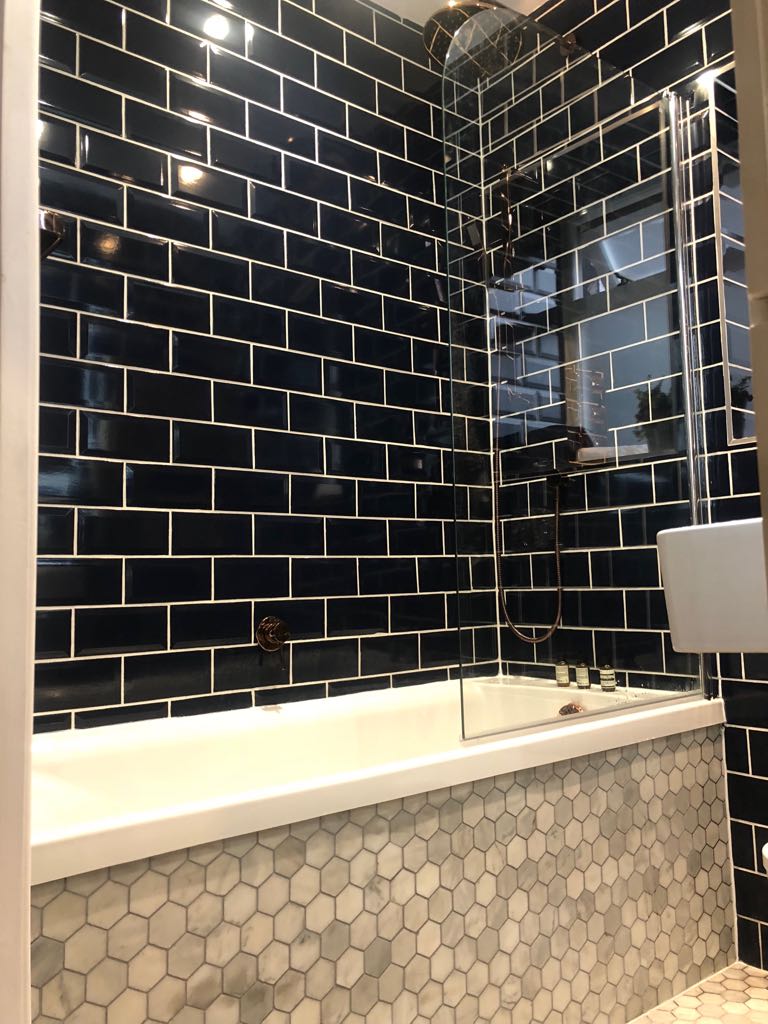 Wood grain tile shower enclosure